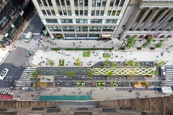 Rooftop view of the street mural in process of being painted.