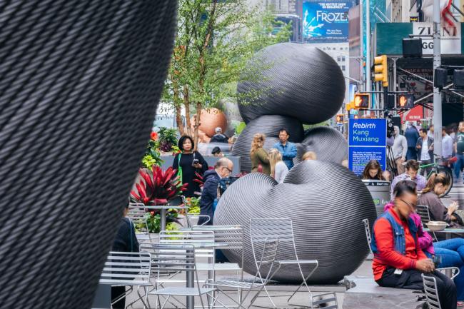 A row of sculptures made from recycled elevator cable