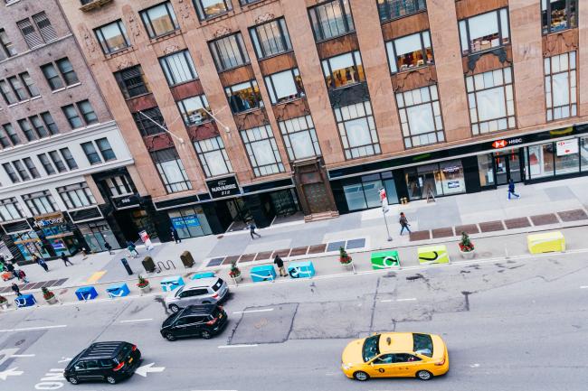 A view from above at a 45 degree angle of the colorful blocks running down seventh avenue. 