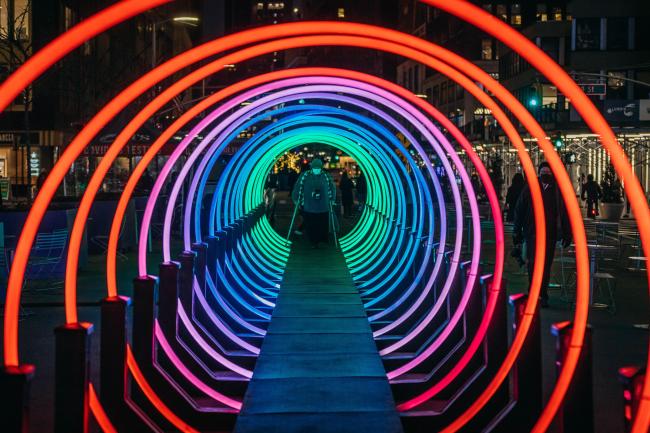Looking through a series of colorful illuminated rings