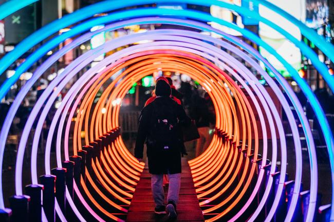 Looking through a series of colorful light up rings