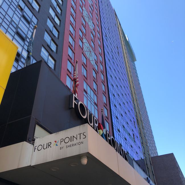 Looking up at the Fourpoints hotel building