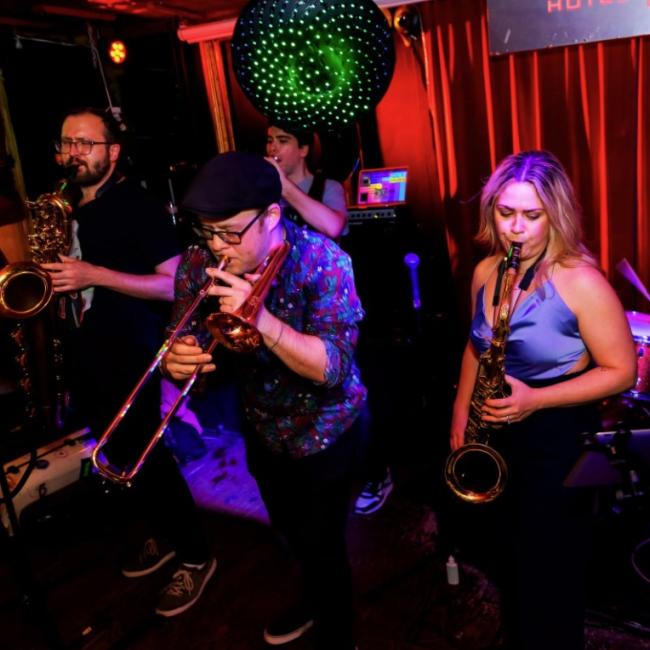 Dingonek band playing brass instruments